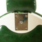 Green and white vintage barber chair