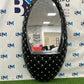 Vanity mirror with black elliptical design