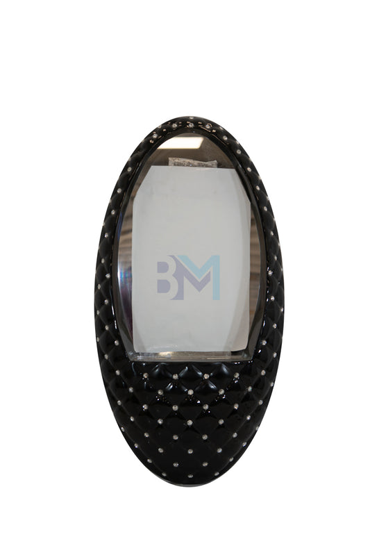 Vanity mirror with black elliptical design