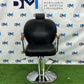 Black barber chair with wooden armrests