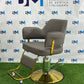 Gray hairdressing chair with gold base